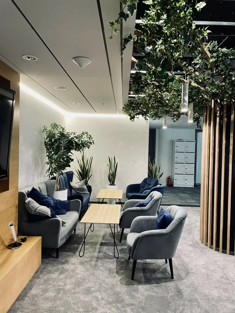 Armchairs and tables in a bright relaxation zone
