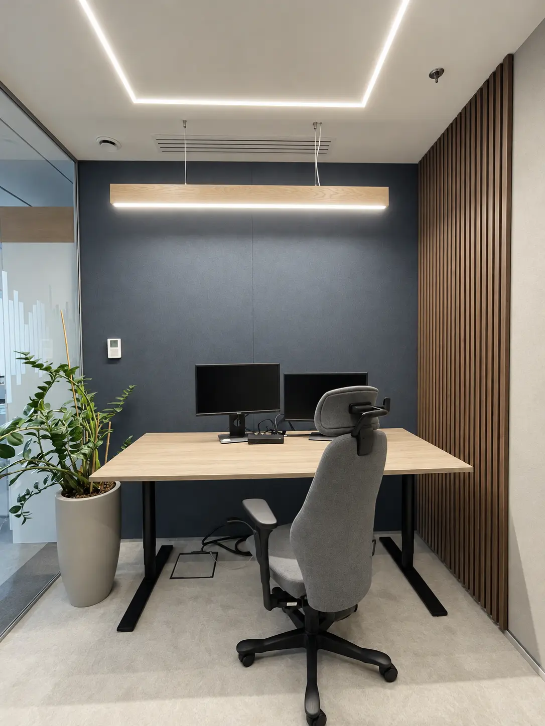 Modern minimalist private office with a plant, designed for focused work